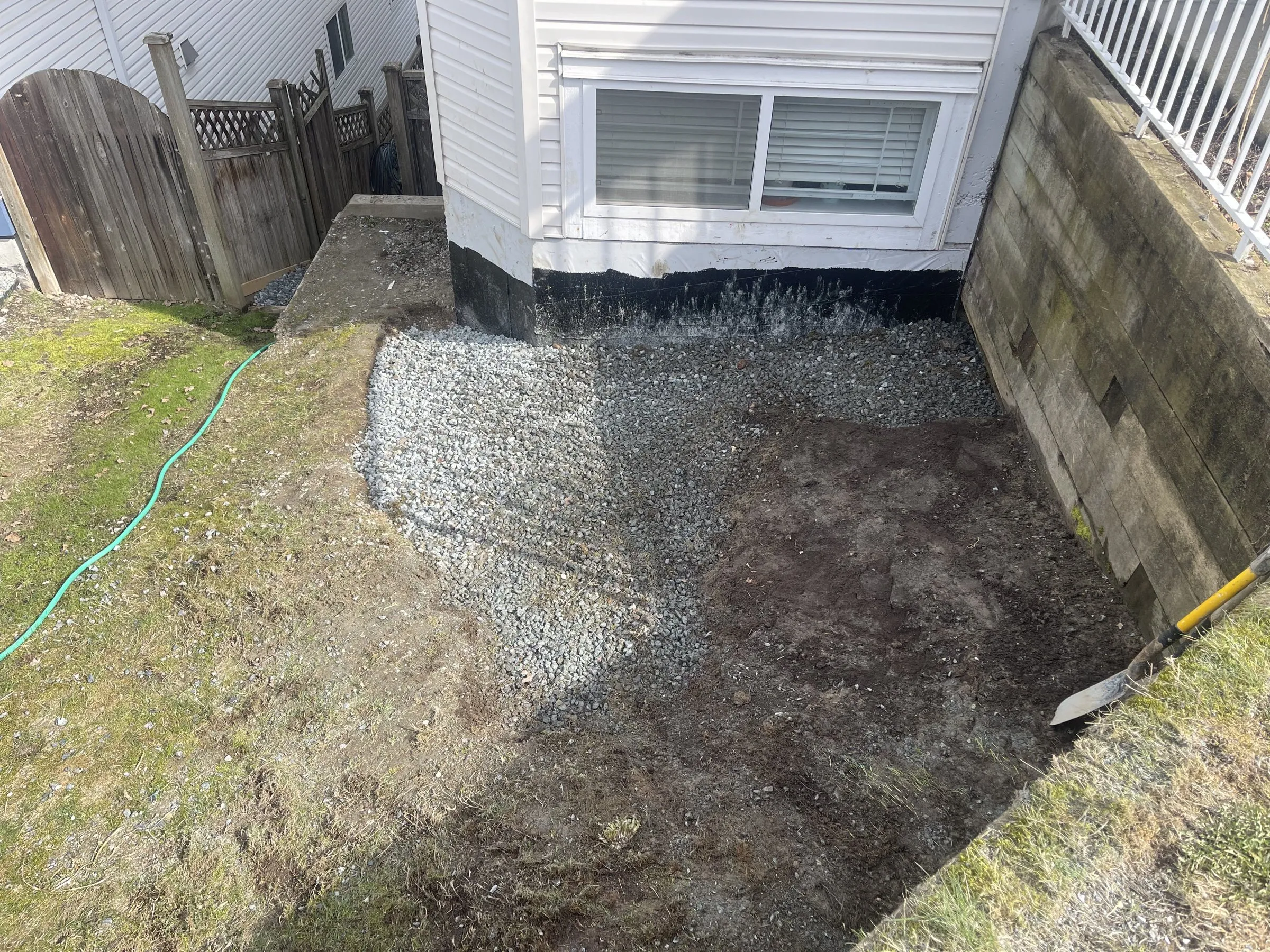 Drain rock along a basement wall