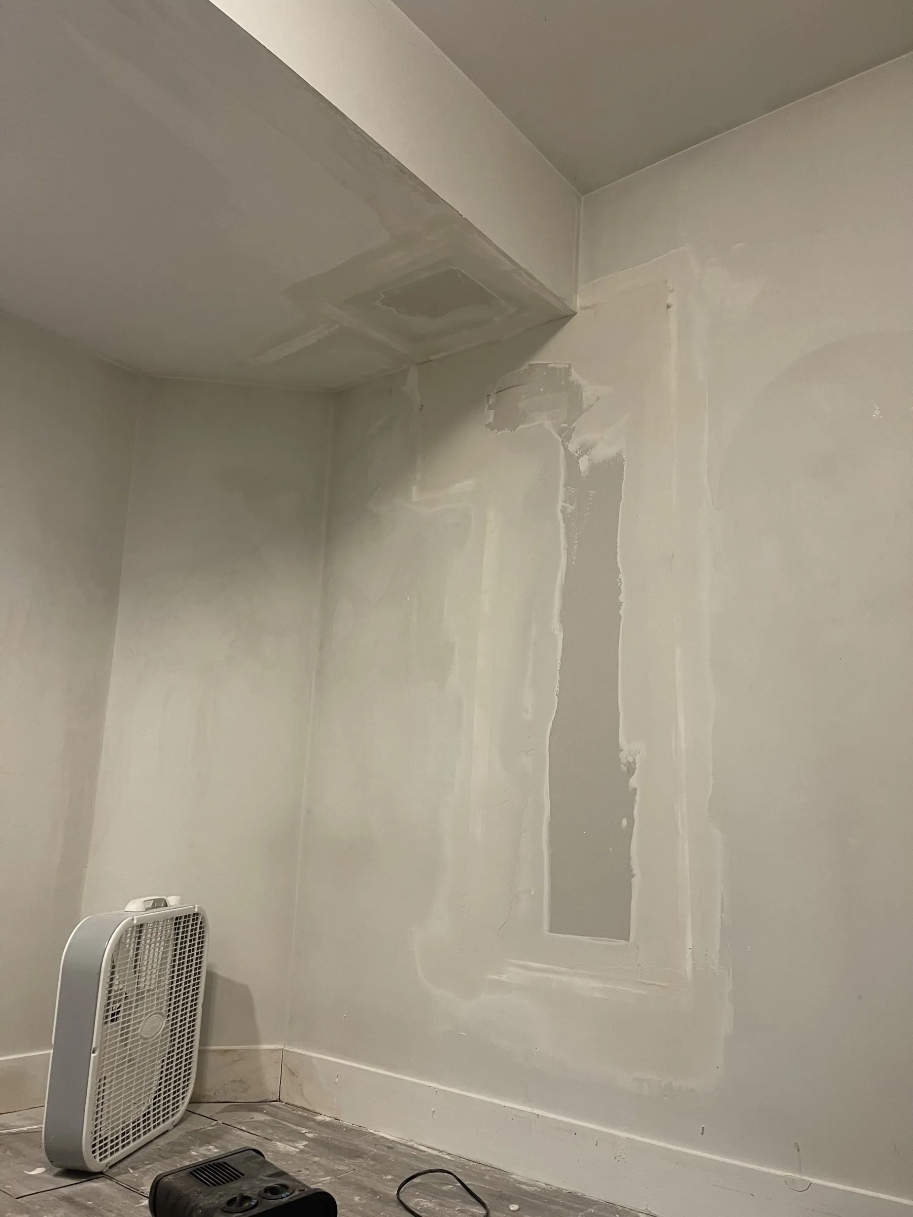 Patches taped and mudded around the bulkhead
