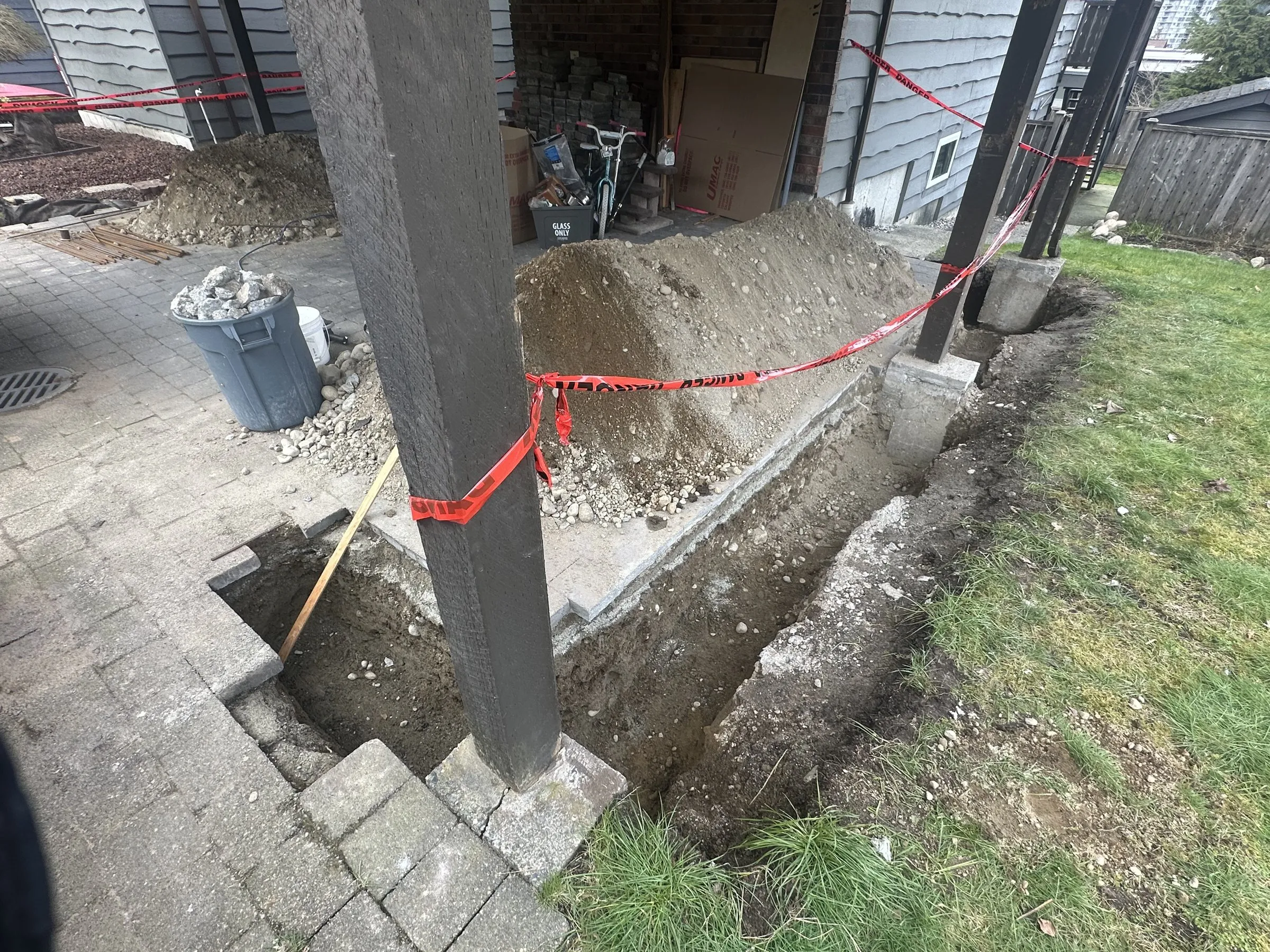 Digging and forming new footings along the carport posts