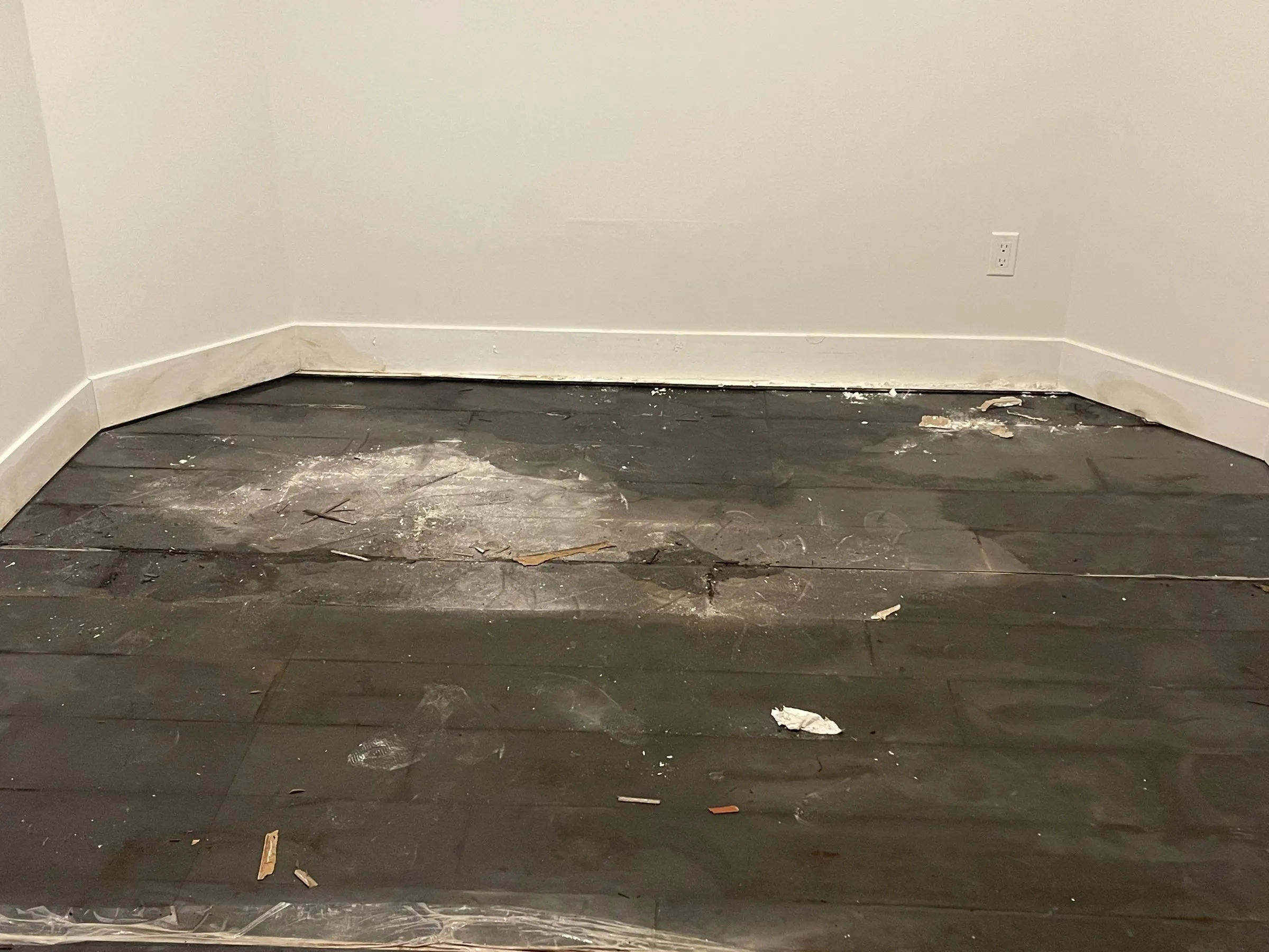 Old flooring removed, new baseboards installed