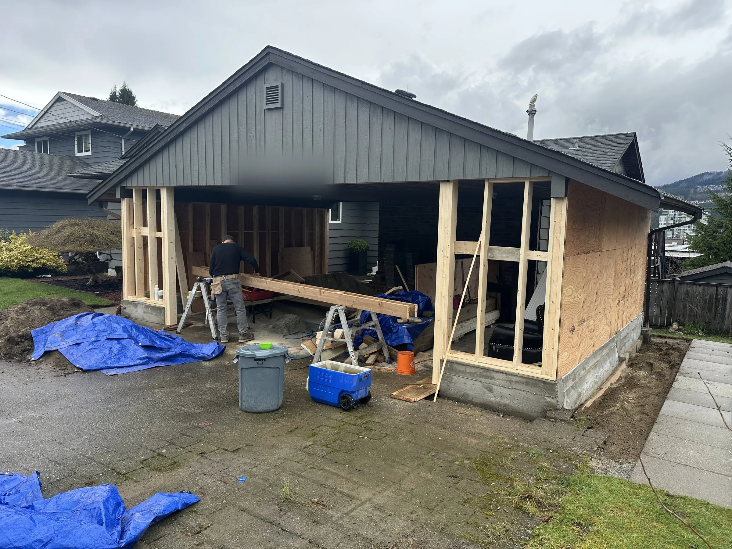 Carport being framed into a garage